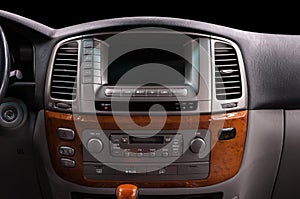 Multimedia screen and control buttons. Classic car interior.