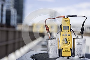 Multimeter and run capacitors on condenser