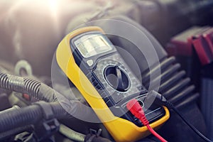 Multimeter or voltmeter testing car battery