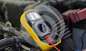 Multimeter or voltmeter testing car battery