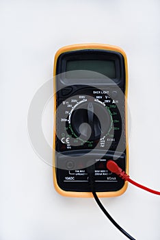 Multimeter on a white background. Voltage and current meter