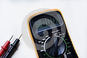 Multimeter on a white background. Voltage and current meter