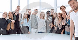 multinational group of young people pointing at you