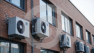 Multiple Air Conditioning Units on a Brick Building Facade