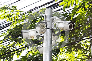 Multiple Angle Outdoor CCTV Camera on the Pole near the Tree