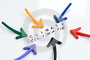 Multiple arrows pointing to cube block combine the word Climate on white background using as environment care, global climate