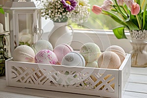 Multiple bath bombs arranged in a white decorative basket, showcasing a range of scents and colors