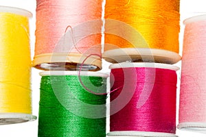 Multiple bobbins of cotton thread