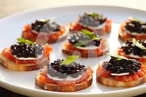 multiple caviar bruschetta servings on a classic white plate