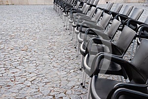 Multiple chairs outdoor, black chair backs