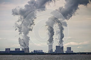 Multiple Coal Fossil Fuel Power Plant Smokestacks Emit Carbon Dioxide Pollution