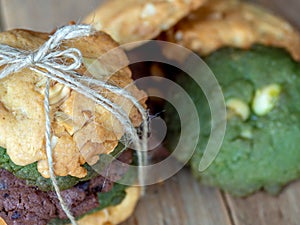 Multiple color cookies inclusive peanut butter, green tea cookies, and Chocolate Chip Cookies. Overlaid by alternating colors on w