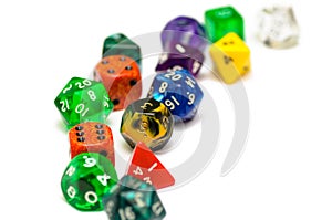 Multiple colorful role playing dices lying on backgroun