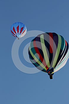Multiple colors flying high during the Albuquerque International Balloon Fiesta with a beautiful Sunrise. photo