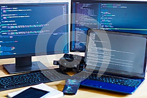 Software developer, freelancer workplace with program code