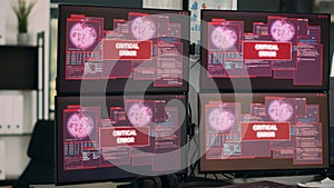 Multiple computers showing hacking alert and security breach