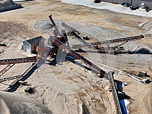 Multiple conveyor belts used at a sand and gravel processing site