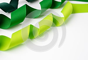 Multiple curled grosgrain ribbons in shades of green photo