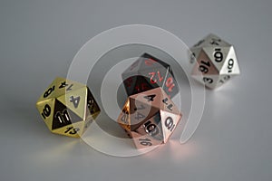 Multiple d20 twenty sided dice die copper silver gold black