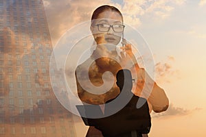 Multiple exposure of businesspeople, cloudy sky and building. Leadership concept