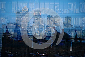 Multiple exposure of city commuters and skyscrapers in London