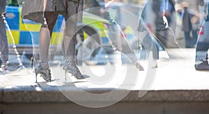 Multiple exposure. Feet of walking people in the city of London. Modern life concept. London