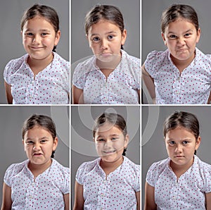 Multiple faces of a little girl on gray background