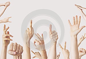 Multiple female hand gestures on gray background