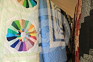 Multiple hanging multicolored  Amish Handmade Quilt