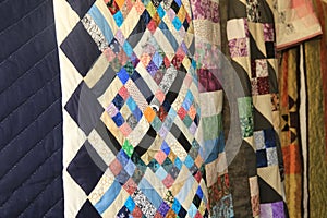 Multiple hanging multicolored  Amish Handmade Quilts3