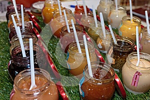 Multiple Jars with Fruity Jam and Teaspoon