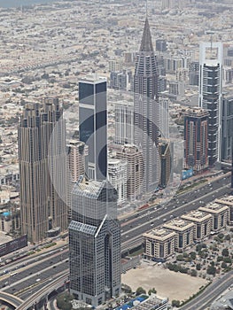 Multiple large buildings and skyscrapers surrounding central district skyline of the downtown urban city.