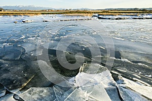 Multiple layers of ice on the Samish River in the Skagit Valley in winter