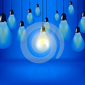 Multiple Light bulbs hanging with cords, one bulb is glowing