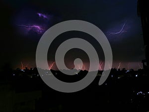 Multiple lightning strikes during monsoon thunderstorm