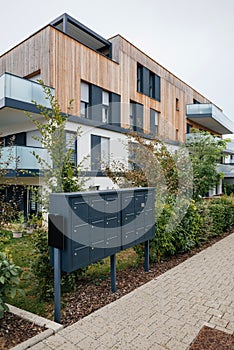 Multiple mailoboxes at the main entrance to modern townhouses in a residential