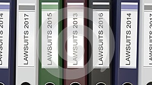 Multiple office folders with Lawsuits text labels different years