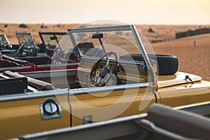 Multiple old Land Rover in the desert of Dubai - UAE