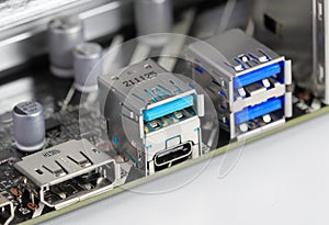 Multiple ports on modern computer mainboard show with Display port, USB 3.2 type A and type C, usb 3.1