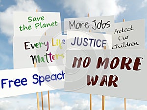 Multiple protest signs held up against a blue sky