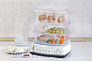 The multiple purpose of electric steaming pot