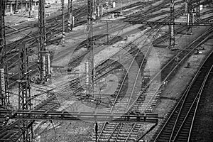 Multiple railway track switches. Industrial view. Transporting system. Symbolic black and white photo for choise