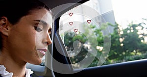 Multiple red heart icons floating against close up of caucasian woman smiling in the car
