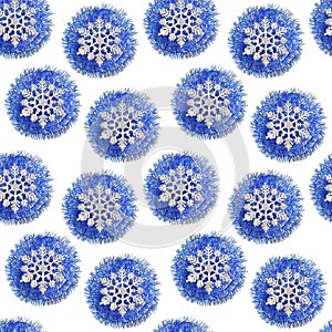 Multiple repeating pattern. blue ball of tinsel and a beautiful silver snowflake on white background