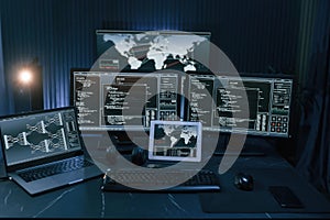 Multiple screens with information. Cyber criminal haker dark room for massive attack of corporate big data servers photo