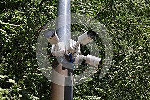 Multiple security cameras on a lamp post