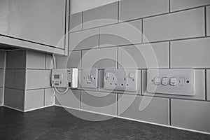 Multiple sockets on a kitchen wall