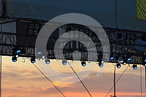 Multiple spotlights on a theatre stage lighting rig