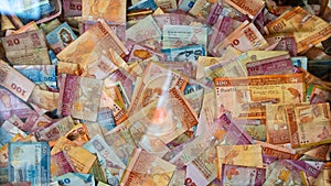 Multiple Srilankan notes in a glass box