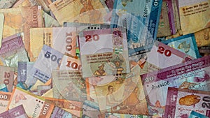 Multiple Srilankan notes in a glass box